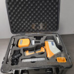 Hitachi X-MET8000 Expert Geo handheld XRF analyzer for mining exploration, geochemical surveys, ore grade control, soil analysis, and elemental testing