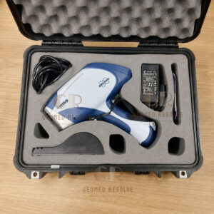 Bruker S1 TITAN 800 handheld XRF analyzer performing non-destructive elemental analysis for metal alloy identification, mining exploration, and quality control.